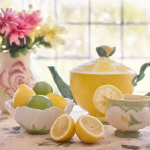 Flowers, citrus, and tea setting with a feminine glow