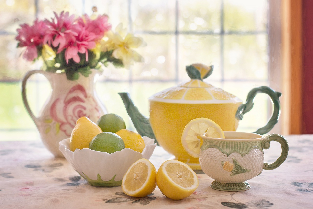Flowers, citrus, and tea setting with a feminine glow